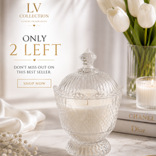 A clear glass lidded candle jar filled with white wax sits on a marble surface in a styled interior scene with white tulips, a second candle, books, and promotional text reading 'LV COLLECTION' and 'ONLY 2 LEFT'.