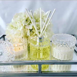 Bella glass canister candle with flat embossed lid